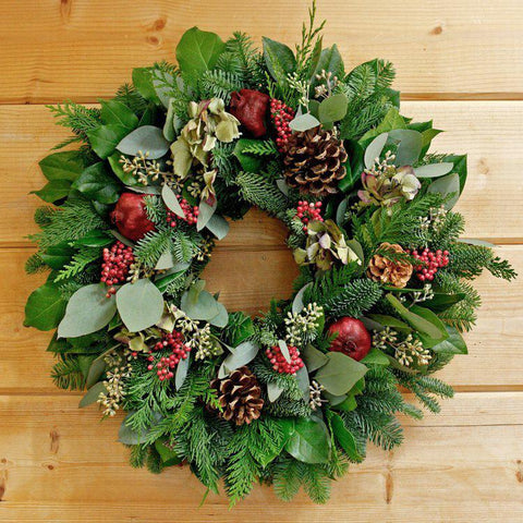 Our 22” Pinecones and Pepper Berries Christmas Winter Wreath is handcrafted with the use of Christmas greenery, pomegranates, pinecones, eucalyptus and pepper berries. 