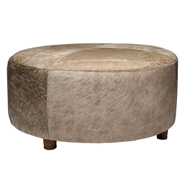 Our Champagne Mid Century Cowhide Ottoman is 39” round x 17.5” tall and makes for a comfy piece for putting up your feet, serving food in trays to guests or just sitting and enjoying how comfortable it is. The wooden legs, in a mid century style, add to style and function of this beautiful piece of furniture.