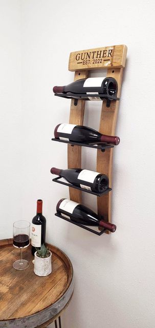 This is our customizable version. Our Reclaimed Oak Wine Barrel Staves Wall Mounted Wine Rack is made from recycled and reclaimed California oak wine barrels and crafted here in the USA, our skilled artisans have used wine barrel staves with four black iron open troughs to hold your one to four wine bottles in place while hanging on your wall. The contrast of the oak and black color is beautiful. This piece can also be customized to your perfection. Size is 29” tall x 9” wide.