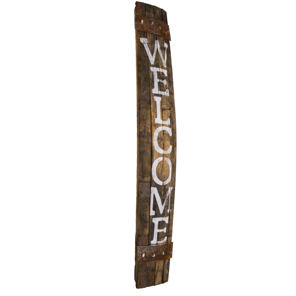 Our Reclaimed Whiskey Barrel Porch Welcome Sign, made in the USA, has been created from reclaimed and repurposed whiskey barrels, this piece has been created from a genuine wood stave from an aged whiskey barrel. Our porch welcome sign will certainly Invite and welcome guests to your home as well as add a bit of rustic charm and appeal to your guests coming up onto your porch. The word WELCOME has been hand stenciled in white onto the stave. Size is 6.5"W x 1"D x 34"H