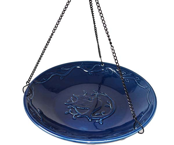 Our Deep Blue Bluebird Hanging Ceramic Birdbath / Birdfeeder features a decorative ceramic bowl finished in a deep blue color with embossing of a bluebird in the center of the bowl and leaf embossing outer rim along with a set of 3 black hanging chains with a hook at the top for easy installation.  