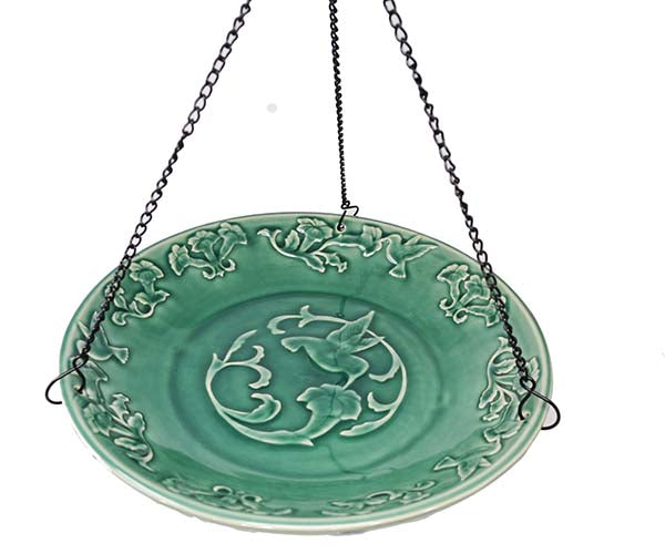 Our Embossed Ceramic Hummingbird Hanging Birdbath / Birdfeeder features a decorative ceramic bowl finished in a deep blue color with embossing of a hummingbird in the center of the bowl and leaf embossing outer rim along with a set of 3 black hanging chains with a hook at the top for easy installation.