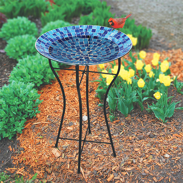 Our Blue Hues Mosaic Glass Birdbath with Black Metal Stand has been inspired by Audubon and crafted from mosaic glass. It will certainly accentuate your bird sanctuary with its purple colors, as well as provide a classic preening spot for your birds to drink, bathe and get refreshed. It can be used as a birdbath or bird feeder. Overall size is 16.25” in diameter x 24” tall.
