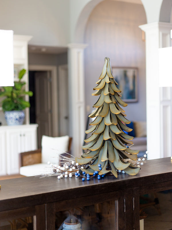 Our Blue Spruce Metal Indoor Outdoor Tree is made in the USA from all weather steel and great as a Christmas Tree for the Holidays and then as an outdoor piece of garden statuary the rest of the year. It is 26” tall x 15” wide and weighs 12 pounds.