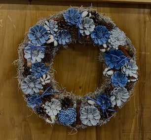 Our North Carolina Blue Colors Collegiate Handcrafted Pinecone Wreath is customizable to your team colors if these are not yours. Our 15” nature inspired wreath also includes cotton, intricately placed within the pinecones to add additional color and a touch of southern charm. Each pinecone is individually cut, beautifully painted and placed to create wreath that shows quality craftsmanship.