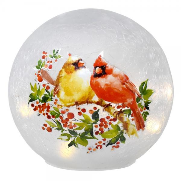 Our Celebrating Cardinal Pair LED Lighted Crackle Glass Globe Lantern will help you celebrate the winter season and light up your Christmas holiday. This festive and colorful decoration is 6” in diameter and made of glass with a crackled finish and features pair of exquisitely painted cardinal that is perched on a pinecone among red berries with a light dusting of snow. Inside the glass globe are a set of string lights with 10 bright LED lights to create a warm ambience glow in any room in your home.
