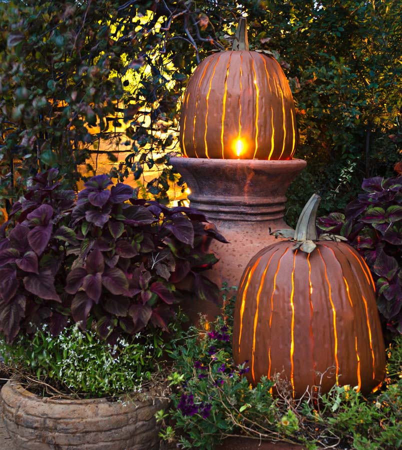 Our Orange Metal Indoor/Outdoor Pumpkin Candle Luminary - set of 2  are 18” tall x 12” in diameter and has a large 6” opening for you to add your own flameless candle or 3-wick jar candle and you will immediately light up any space day or night. Our steel construction pumpkins are rust-proof, powder coated, UV resistant and so great for creating indoor or outdoor beauty, season after season. Also available in white and expresso colors.