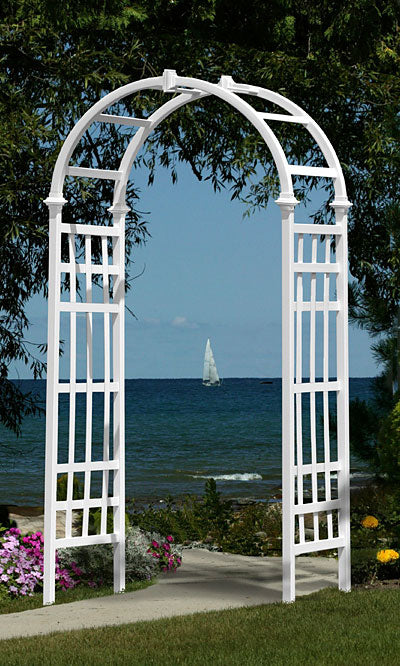 Our Eden’s Garden White Vinyl Arbor is 80” tall and will create a beautiful and classic theme in your garden. Along with a traditional look, this arbor has rectangular paneling on each side, reminiscent of Greek architecture. The gently arched top has square trim at the top and base, offering additional detailing. The crisp white finish adds a timeless feel, while the sturdy vinyl construction will last for season after season. Size is 39"W x 23"D x 80"H.