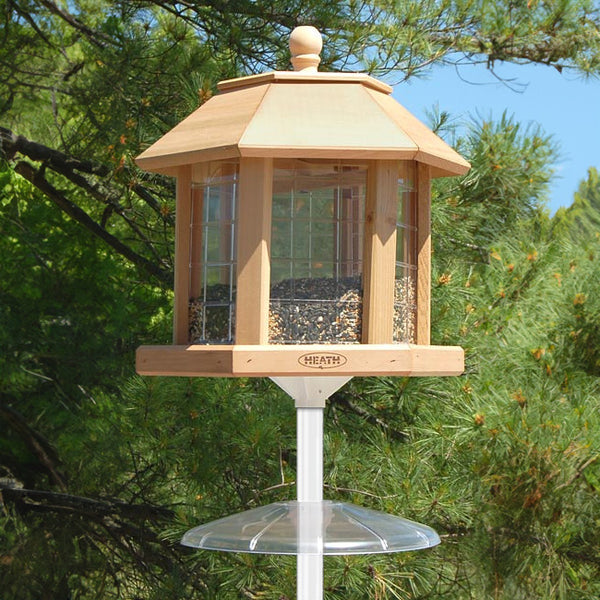 Our Grande Gazebo Cedar Large Capacity Bird Feeder Set is a stand alone, large capacity, hopper style, bird feeder. This feeder comes complete with gazebo bird feeder, made here in the USA, an in-ground mounting pole, seed scoop, to easily add seed to the feeder, mounting bracket, and squirrel baffle, and… it holds an astonishing 11.5 quarts of seed. The feeder size is 15.5"L x 17.5"W x 17.5"H.