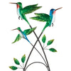 Up close look. Our Hummingbird Decorative Metal Trellis Stakes will both support your plants while adding decorative garden décor accents to anywhere in your yard. The embossed metal has been hand painted with an iridescent metallic finish, which is weather and fade resistant.