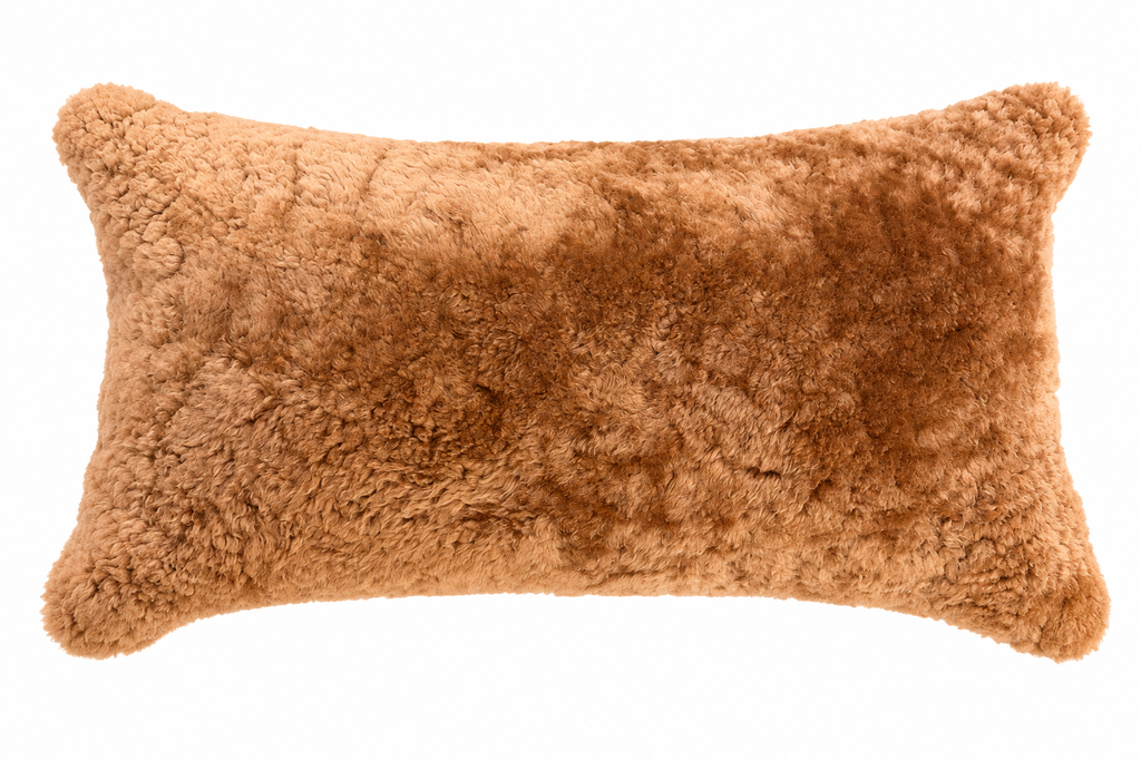 Our maple brown colored New Zealand sheepskin pillow is soft and and cozy for any room in  your home. 