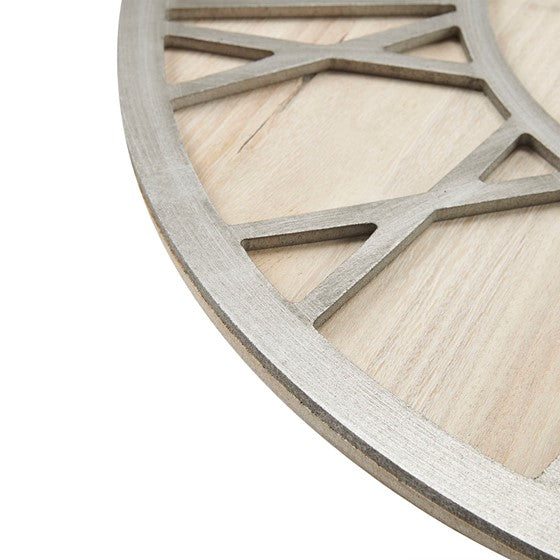 Shown side of clock. Our large Natural Wood and Gray Metal Wall Clock will bring timeless sophistication to any space, while adding a bit of rustic charm. Featuring large Roman numeral numbers, quartz movement, and a hanger hook on the back, it’s a breeze to hang this 23.6" diameter clock. 