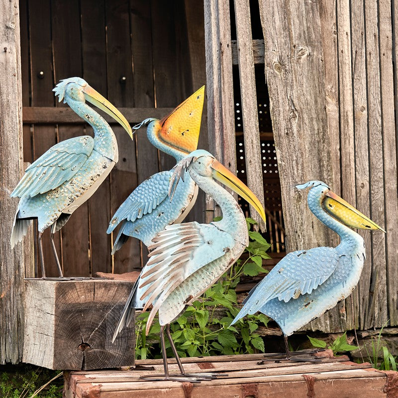 Our Persnickety Pelicans Coastal Inspired Garden Statuary comes as a set of 4. These metal pelican coastal garden birds are crafted from high quality metal, powder coated for added protection against weatherization, and individually hand painted for a unique one-of-a-kind outdoor decoration.  Whether you add them to your coastal home or rustic home, they will enhance any front lawn, backyard, or bird garden with their distressed coastal blue finish and stunningly detailed bodies and yellow beaks