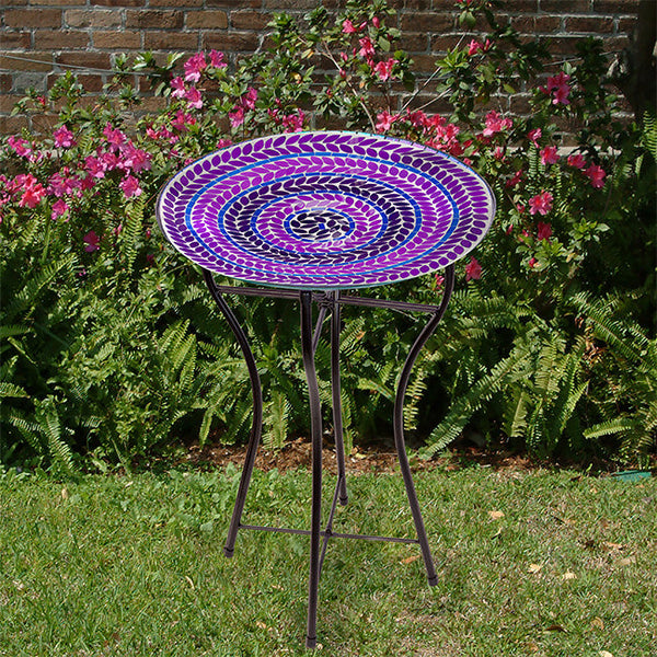 Our Purple Hues Mosaic Glass Birdbath with Black Metal Stand has been inspired by Audubon and crafted from mosaic glass. It will certainly accentuate your bird sanctuary with its purple colors, as well as provide a classic preening spot for your birds to drink, bathe and get refreshed. It can be used as a birdbath or bird feeder. Overall size is 16.25” in diameter x 24” tall.