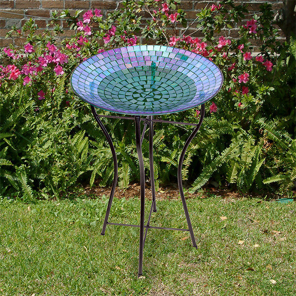 Our Rainbow Mosaic Glass Birdbath with Black Metal Stand has been inspired by Audubon and crafted from mosaic glass. It will certainly accentuate your bird sanctuary with its purple colors, as well as provide a classic preening spot for your birds to drink, bathe and get refreshed. It can be used as a birdbath or bird feeder. Overall size is 16.25” in diameter x 24” tall.