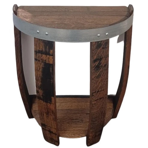 Our Reclaimed Oak Wine Barrel Head Half Round Table has been created by skilled artisans who have cut an oak wine barrel in half, repurposed the silver metal ring, added four stave legs for strength and then added another half round barrel head at the bottom to create a shelf for increased stability for adding extra wine décor. It is available in 5 beautiful finishes of your choice. 