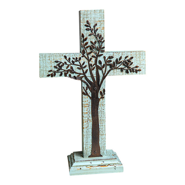 Our Tabletop Inspirational Metal Tree on Wood Cross is a beautiful pastel blue wood cross which features a metal tree that hugs up and across the cross. The elegant design portrays the tree holding on tight to the cross, what we as Christian’s would also want to do. It is certainly an inspirational sculpture and a beautiful accent piece to add to your home. The cross stands 12” tall x 7.8” wide x 2.95” deep.  