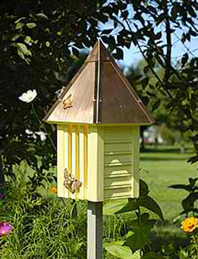 Our Yellow Flutterbye Butterfly House and Garden Stake features two-tone colored garden decor butterfly houses uniquely styled for you and your butterflies. Made in the USA of select cypress siding, solid copper hipped roof with authentic corner boards, slotted front for the butterflies to enter and finished with copper butterfly adornments to add additional decorative detail.  