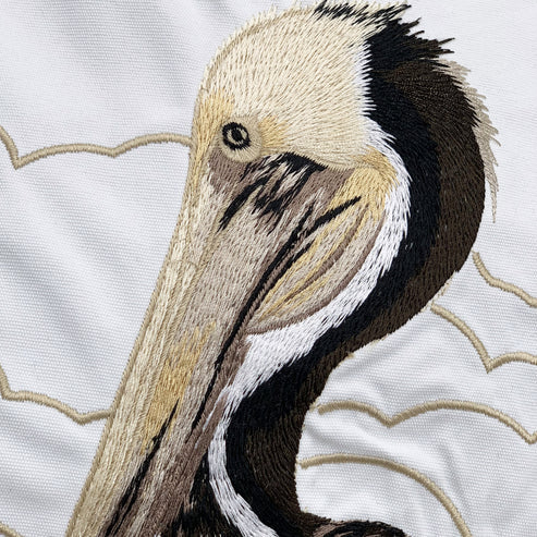 An up close and detailed view of our Dockside Pelican Embroidered Indoor Outdoor Pillow.