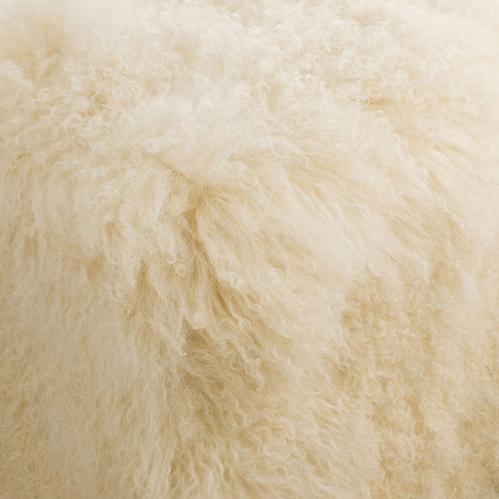 This is our off white colored 18" square Tibetan/Mongolian Lamb Fur Stool that is also available in many other colors