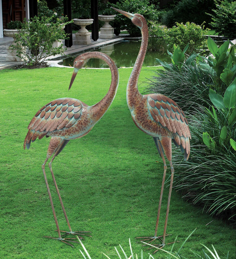 These stately and beautiful heron will add beauty, serenity and color to your garden or patio. The verdigris color is vibrant along with the brown feathers, making them a striking pair in your garden. 
