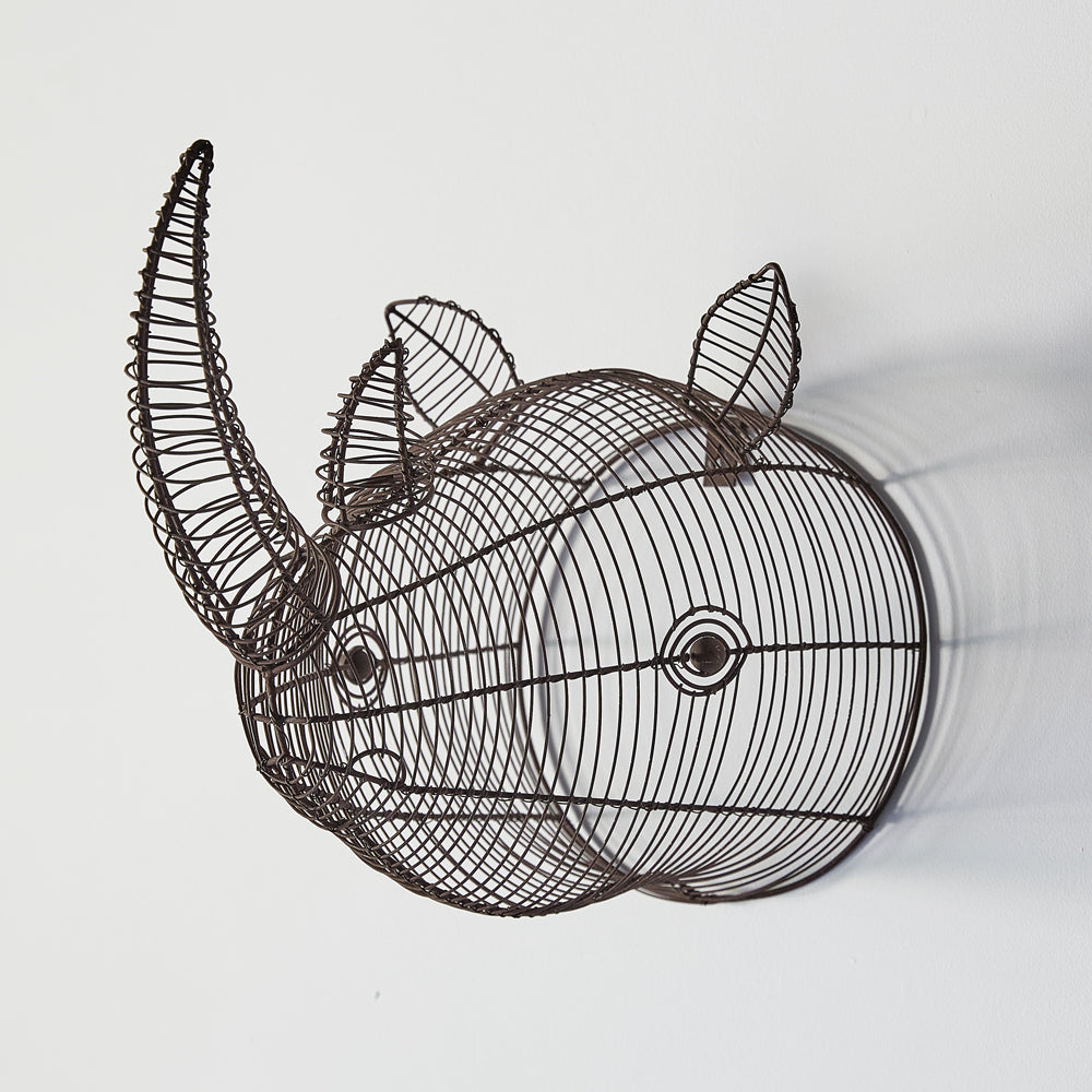Our African Inspired Wire Wall Mount Rhino Head will delight all family members with this uniquely decorative Rhino head wall decoration. Kids love this in their bedrooms and adults love them as a decorative wall décor expression. Our rhino has been handcrafted and hand wrapped from wire, and ready to make a statement in your.  Its size of 9¾''W x 16''D x 12''H will forever change a dull wall into something extraordinary.