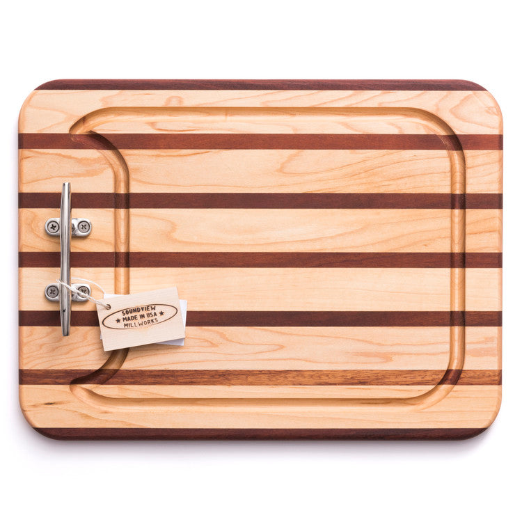 This picture shows our Appetizer Cutting and Carving Board with Decorative Handle and features our signature multi stripe pattern along with our recessed ¾” juice groove for catching drippings while carving. It is available in 3 sizes and 2 patterns.