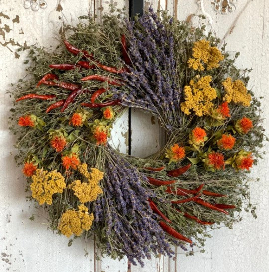 Our Aromatic Lavender, Chili and Safflower Preserved Wreath - 15” features a unique blend of fragrance and preserved yarrow, lavender, safflower, savory and chilies all meticulously intertwined onto a twig base… all harvested here in the USA
