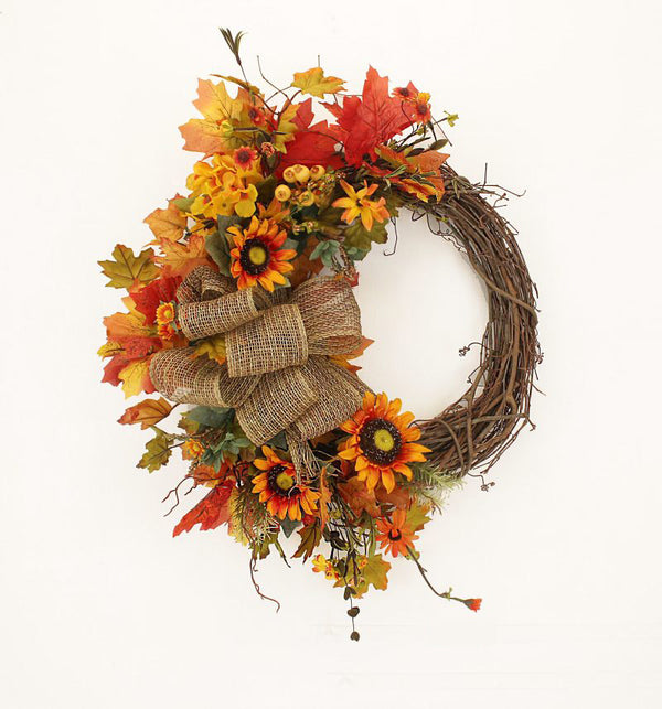 Our Autumn and Burlap Fall Front Door Wreath (23 inch)  features a grapevine wreath that that is exposed on one side and then uniquely crafted on the other side with an assortment of eye catching orange and yellow silk flowers with lots of fall colors, and a beautiful burlap bow that captures the elegance of this wreath
