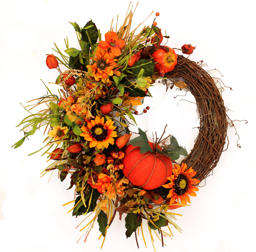 Autumn Harvest Decorative Fall Front Door Wreath is 23" in diameter and is beautifully handcrafted with an array of lush fall colors!  It features a grapevine wreath exposed on one side with fruit, pumpkin and Japanese lanterns, along with an abundance of silk foliage on the other side.