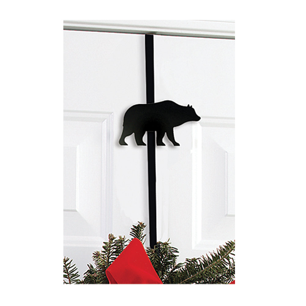 Our Bear Wrought Iron Wreath Holder is handcrafted in the USA and decorative for year round use indoors or outdoors. It features a silhouette of a bear and makes for a great addition to your rustic cabin décor. It is 13” in length x 4” wide and fits a door up to and including a 1-3/4” door thickness.