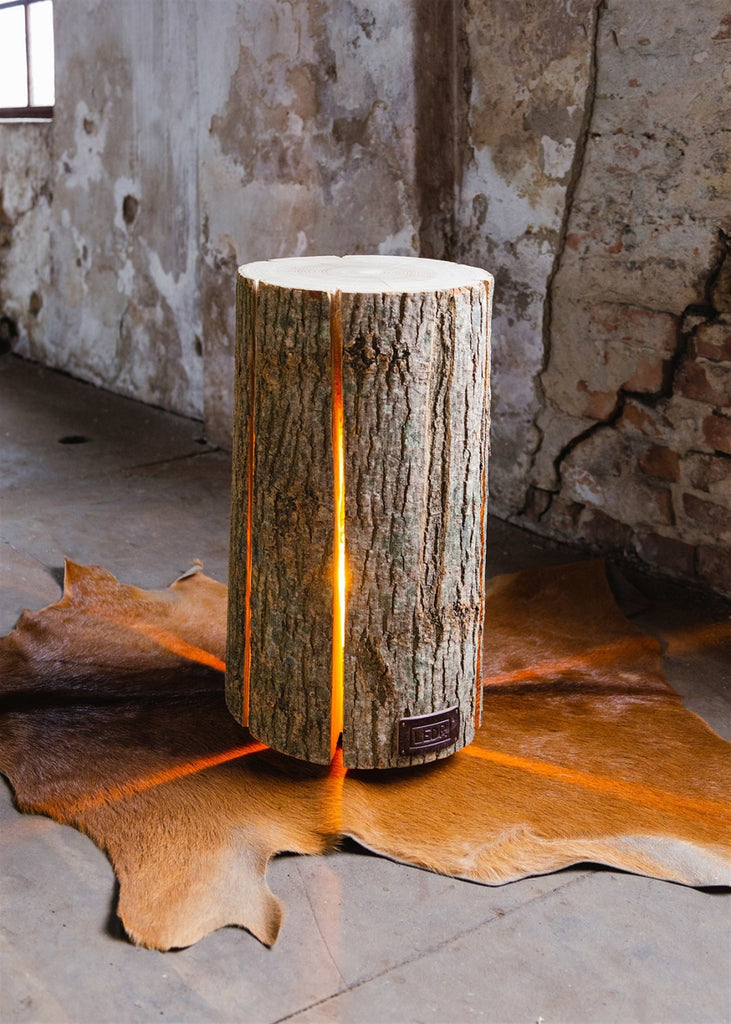 Our Ash Wood Tree Stump Luminary Lantern Table (shown medium size) is available in 3 styles, these authentic reclaimed and repurposed wood tree stumps have been handcrafted with spaced cut grooves around the diameter to allow light to show through.   Each stump has been given a second life from wood that otherwise would have been discarded. So sustainable these wood stumps are! Each one easily plugs into your electrical outlet and great for indoor use or on a protected patio.