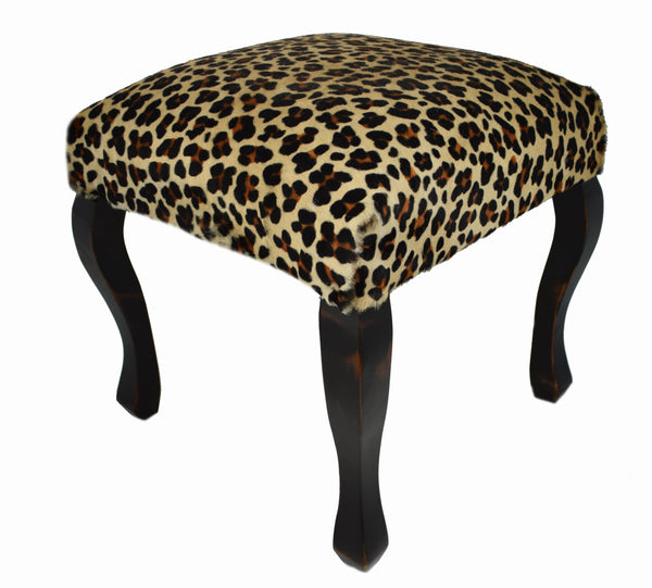 Accentuate your wild side with our Cheetah Printed Cowhide Upholstered Stool
