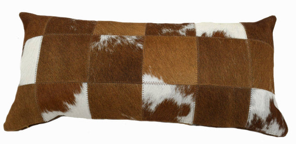 Chestnut Red and White Cowhide Patchwork Lumbar Pillow is 20” long x 12” tall and features an assortment of chestnut red and white cowhide colors … all patchworked together to make a decorative pillow.