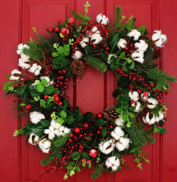 Our Cotton and Christmas Winter Berries Front Door Wreath is handcrafted here in the USA and features an assortment of eye catching wispy greenery, pinecones, white cotton and red berries. This 24” in diameter wreath is ready to be proudly hung on your front door décor to capture curb appeal at its finest with lots of color, creativity and style for Christmas and the winter season as well.