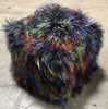 Our 18" square Dark Confetti, Multi-colored, Tibetan/Mongolian Lamb Fur Pouf Ottoman features soft and fluffy natural curls that have had the strands and tips dyed in multiple colors.