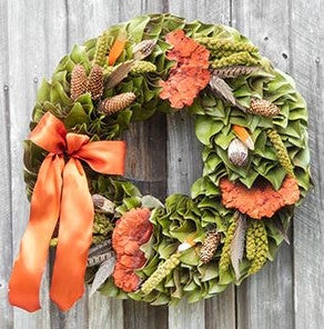Our Delightfully Fall Dried and Preserved Magnolia Wreath is available in 3 sizes 18’, 23” and 28”.  Handcrafted here in the USA, each magnolia leaf is cut fresh, then dried and turned and placed onto this wreath to give it an abundance of fullness. It features an assortment of dried mushrooms mixed with verdant millet and feathers are added, along with a lovely festive colored fall bow.  