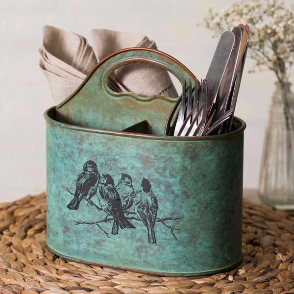 Our Distressed Teal Blue Metal Songbirds Caddy comes with a handle with 3 divided sections to use for carrying silverware, napkins, art supplies, paper and pencils for the kids and so much more. We have had folks use it in the kitchen as a kitchen utensils holder.