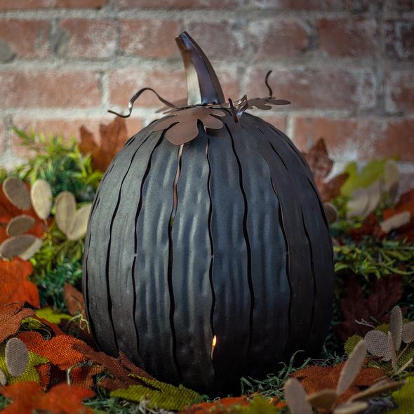  Our Expresso Metal Indoor/Outdoor Pumpkin Candle Luminary is 18” tall x 12” in diameter and has a large 6” opening for you to add your own flameless candle or 3-wick jar candle and you will immediately light up any space day or night. Our steel construction pumpkins are rust-proof, powder coated, UV resistant and so great for creating indoor or outdoor beauty, season after season. Also available in orange and white colors. 