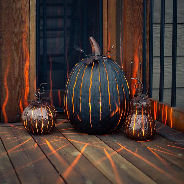  Our Expresso Metal Indoor/Outdoor Pumpkin Candle Luminary is 18” tall x 12” in diameter and has a large 6” opening for you to add your own flameless candle or 3-wick jar candle and you will immediately light up any space day or night. Our steel construction pumpkins are rust-proof, powder coated, UV resistant and so great for creating indoor or outdoor beauty, season after season. Also available in orange and white colors.  Shown lit with candle, not included.