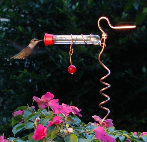 Our distinctive Copper Flower Pot Hummingbird Feeder with Decorative Red Marble comes as a set of two and they are great to add to a planter or just stick in the ground to give the hummingbirds a much loved nectar feast