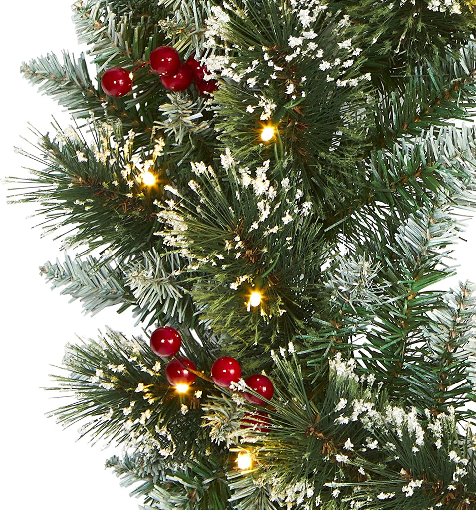 Our Frosted Pine Front Door LED Lighted Wreath is 24” in diameter and has been intricately designed from a rich collection of pine foliage, carefully accented throughout with bright red holly berries that look incredibly lifelike - all frosted with a hint of faux snow. Arriving pre-strung with 35 clear LED lights to effortlessly illuminate either a wall or door.