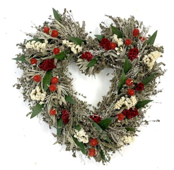 Our Heart’s Desire Dried and Preserved Wreath is 15” in diameter and handcrafted here in the USA from preserved and dried red and white florals that perfectly accent the preserved and dried herbs that encase the entire heart shape of the wreath.