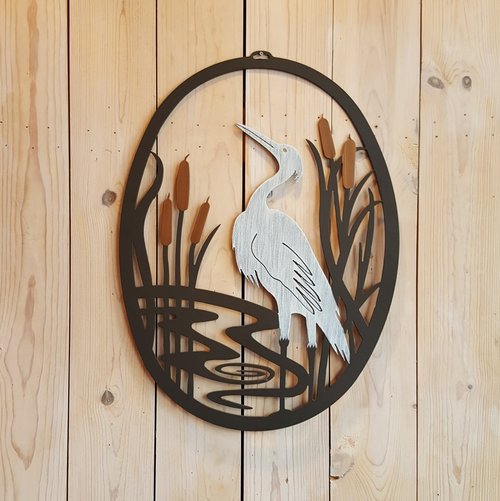 Our Blue Heron Metal Indoor Outdoor Wall Art is uniquely handcrafted in the USA by skilled artisans. Each piece is custom made to order and powder coated for outdoor use or indoor use and it captures the artist’s creative beauty of this coastal bird and theme all in one magnificent wall hanging.