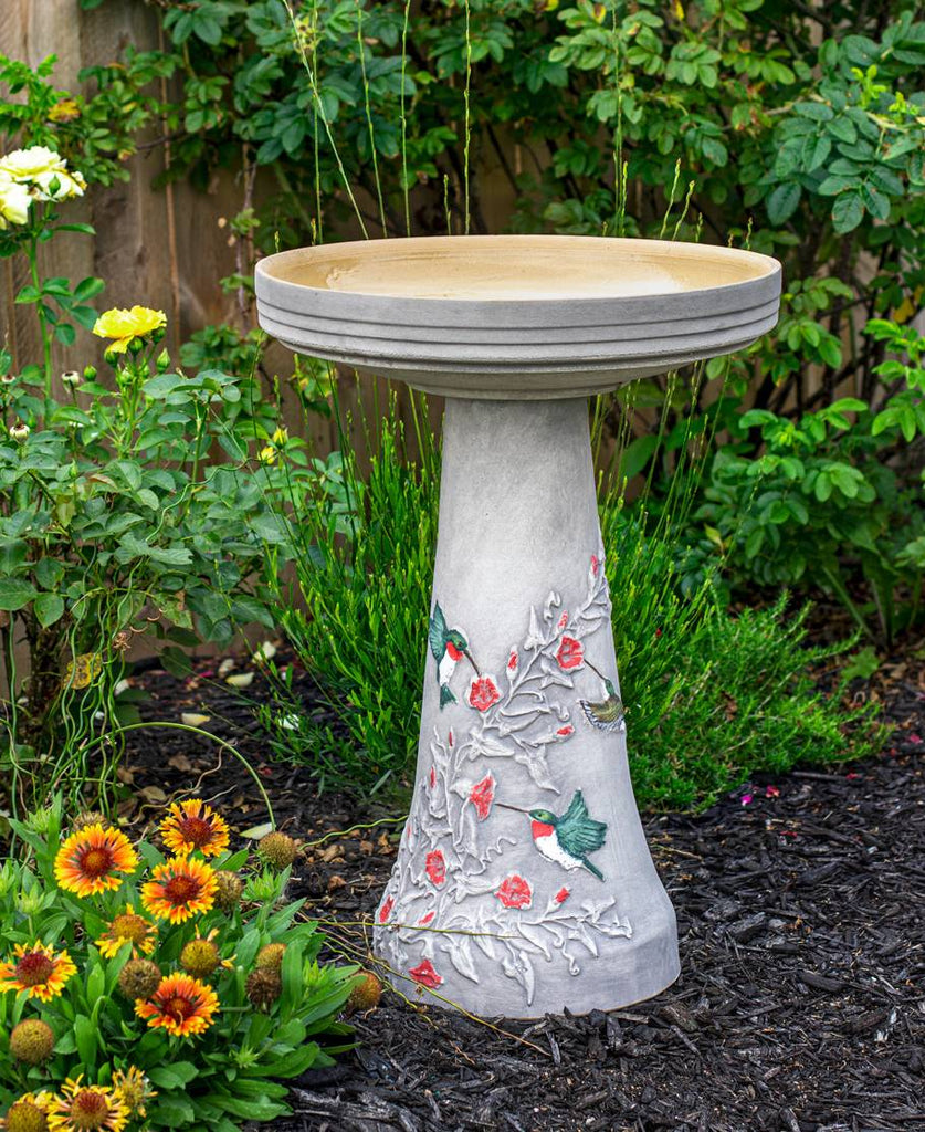 Our Hummingbird Handcrafted Clay Birdbath Set on asoft gray background is beautifully handcrafted and painted in the USA
