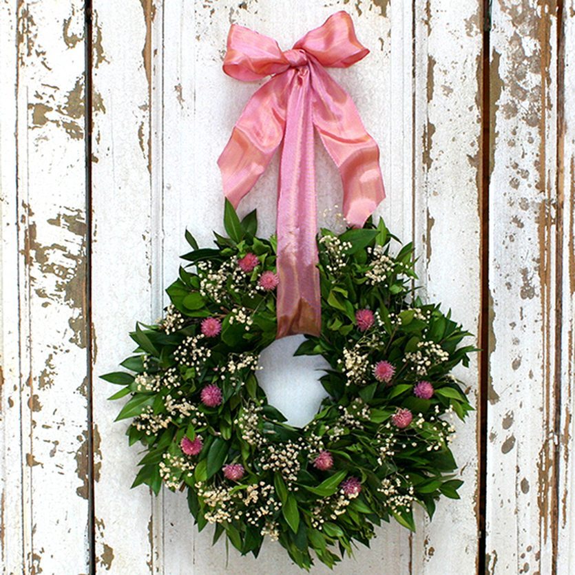 Our freshly made It's A Girl Fresh and Fragrant Wreath – 10" will make a great gift for a baby's room