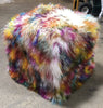 Our 18" square Light Confetti, Multi-colored, Tibetan/Mongolian Lamb Fur Pouf Ottoman features soft and fluffy natural curls that have had the strands and tips dyed in multiple colors.