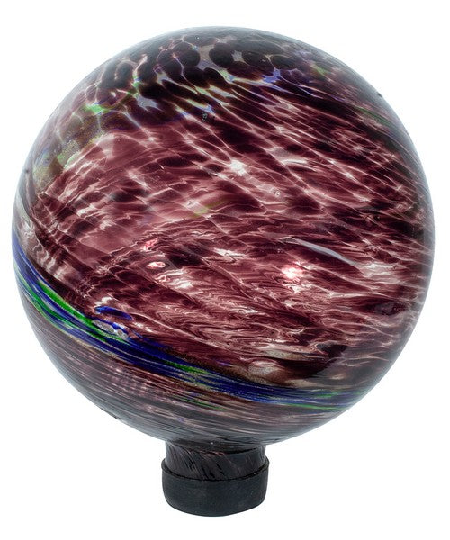 Our 10” in diameter Mauve Swirl Glow in the Dark Glass Gazing Globe is handcrafted of hand blown glass with crystals inside the globe that absorb light energy from any light source during the day and create a wonderful green glow at dusk. During the day the colors of mauve, with accents of white, blue and green will gracefully decorate your garden with lots of color and style.