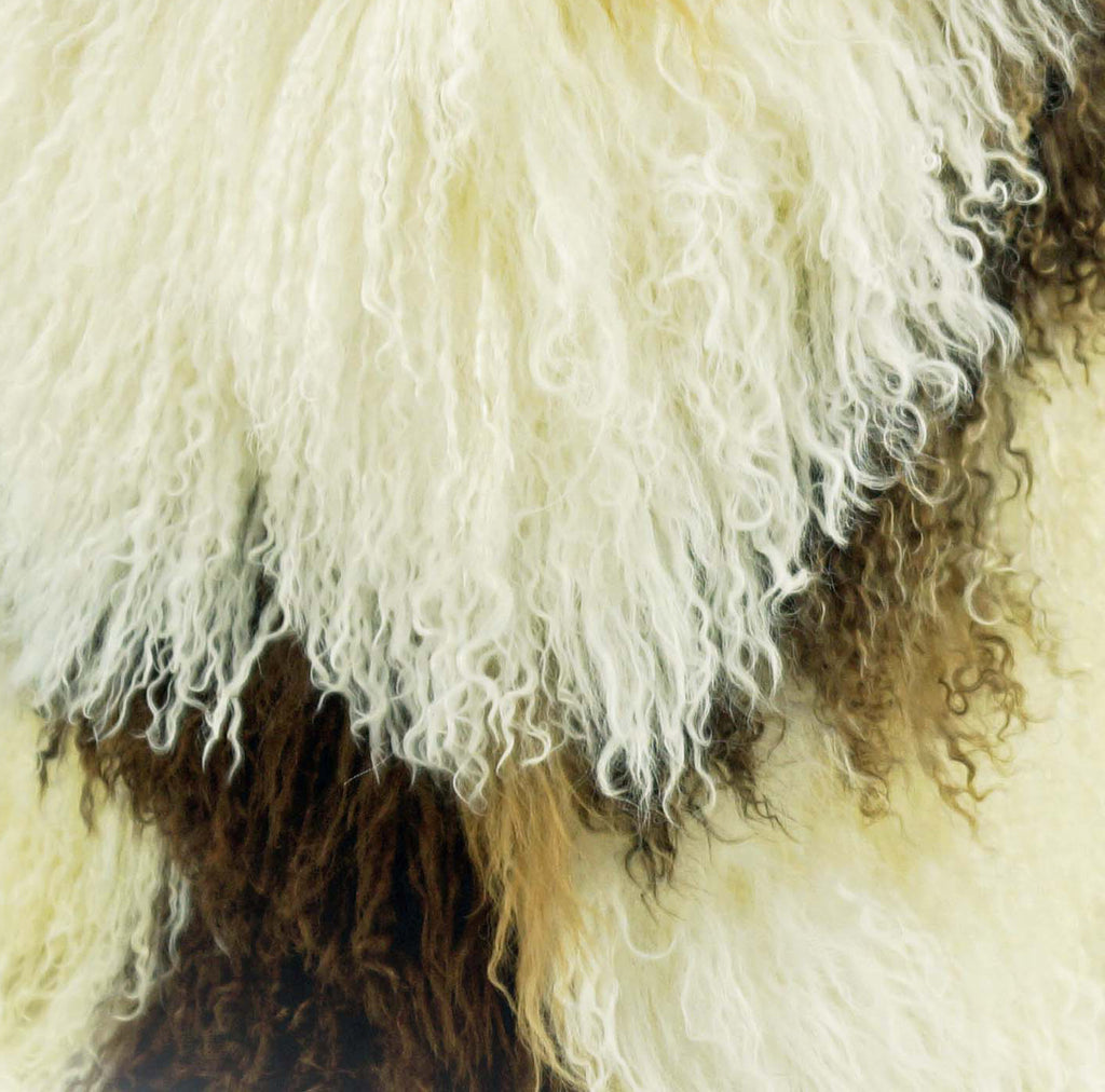 This is our natural colored 18" square Tibetan/Mongolian Lamb Fur Stool that is also available in many other colors