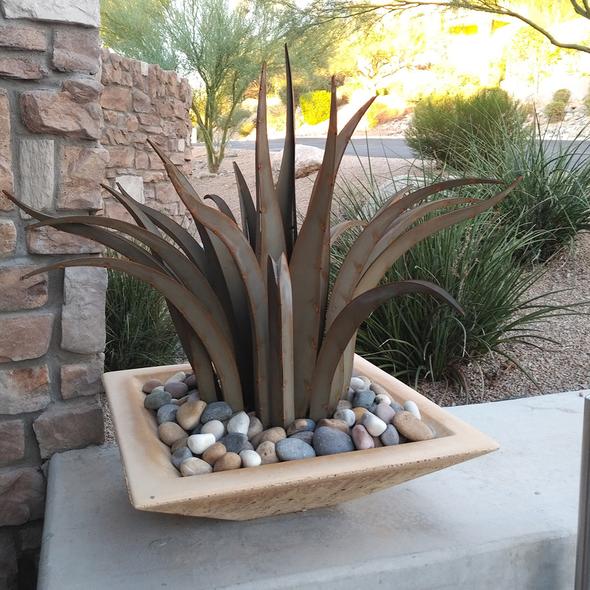 Shown planted in a planter, our Octopus Agave Succulent Metal Yard Art Sculpture are available in two sizes and handcrafted here in the USA, our skilled artisans have certainly captured the beauty of these agave garden décor metal sculptures. You can plant them in the ground or in a planter and they create maintenance free, beautiful landscaping pieces.